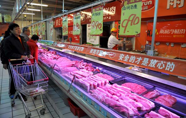 Pork prices fall, forcing down inflation rate