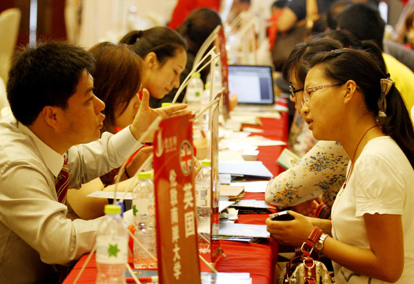 Visitors consult information on studying abroad at an international education exhibition in Nanjing, Jiangsu province, in July. About 90 universities from 12 countries took part in the exhibition. Dong Jinlin / for China Daily  Old views are changing on overseas education