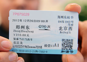 A resident of Zhengzhou,capital of Henan province, displays a ticket for the Beijing-Guangzhou highspeed railway he bought on Thursday. XIANG MINGCHAO / CHINA DAILY Tickets for new bullet train route selling fast