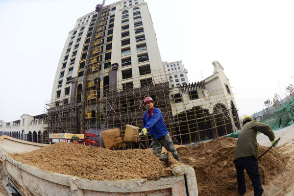 A housing project in Qingdao, Shandong province, on Thursday. Despite government measures to cool property market, housing demand still grew steadily in the second half of 2012. Property prices rise in more big cities