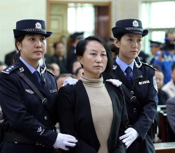 Gong Aiai, suspected of owning multiple properties under false identities, stands trial in Yulin city, Northwest China’s Shaanxi province, Sept 24, 2013. 'House sister' denies charge of faking ID