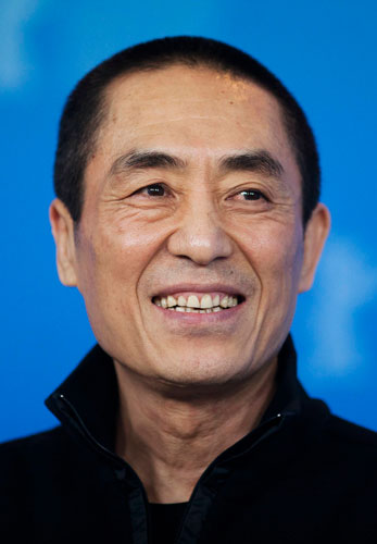 Chinese director Zhang Yimou poses during a photocall to promote the film 'The Flowers of War' at the 62nd Berlinale International Film Festival in Berlin in this February 13, 2012 file photo.  Prolific father Zhang Yimou apologizes